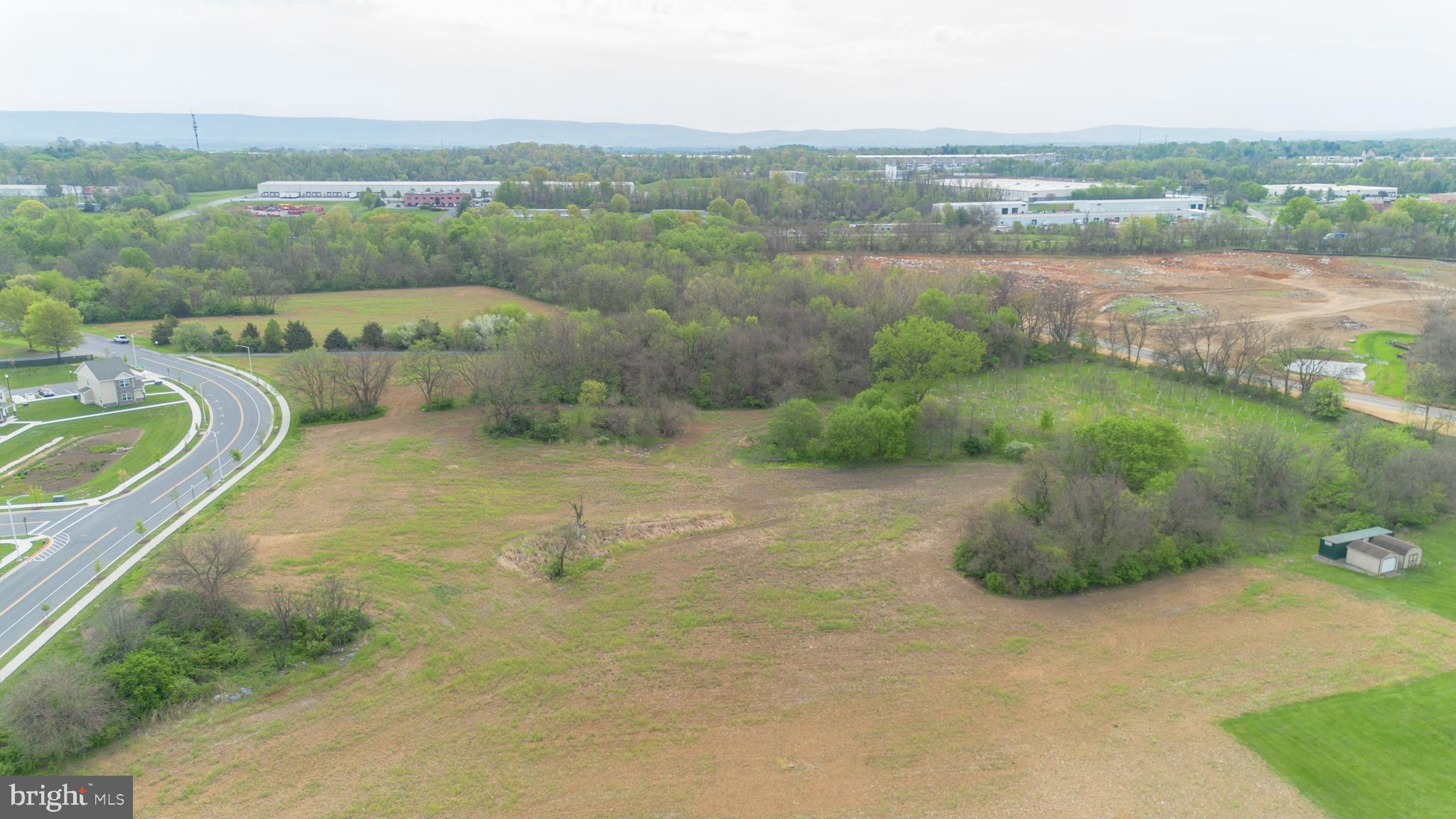 Insurance Way Hagerstown, MD 21740 - Photo 9 of 16 an aerial view of a house with a yard and lake view