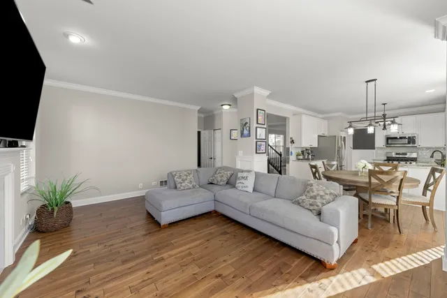 a living room with furniture fireplace and a flat screen tv