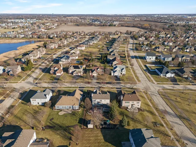 an aerial view of residential building with parking