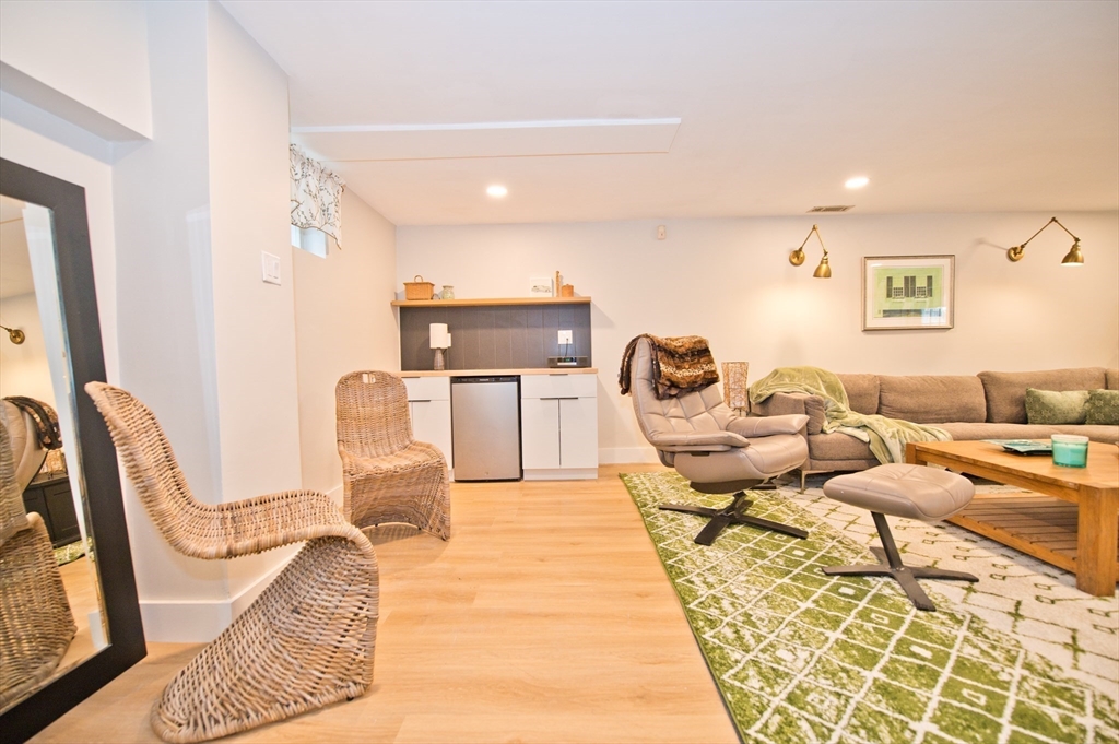 16 Warren Avenue Newton, MA 02465 - Photo 26 of 42 a living room with furniture and a rug
