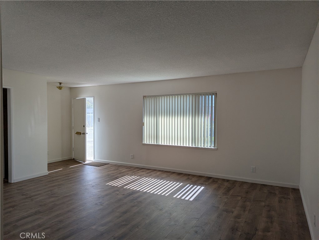 280 Mary Hemet, CA 92543 - Photo 3 of 18 an empty room with wooden floor and windows