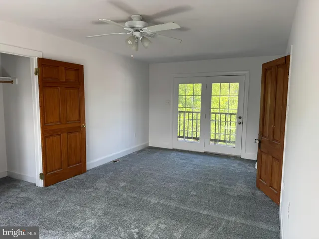 a view of balcony with wooden floor