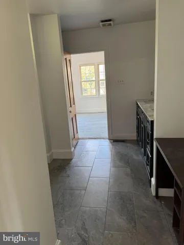 a bathroom with a tub shower and a sink