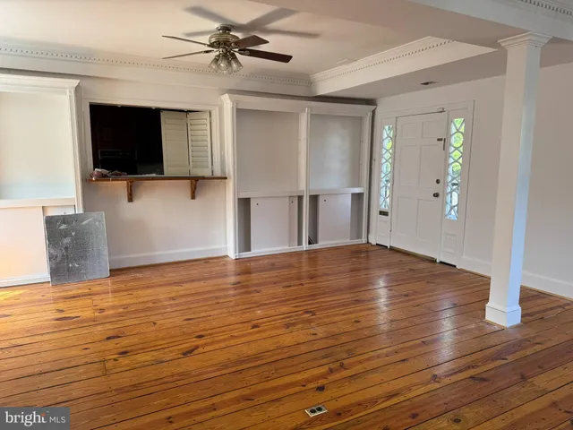 a view of a balcony with wooden floor