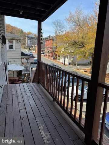 a view of a balcony with sitting area