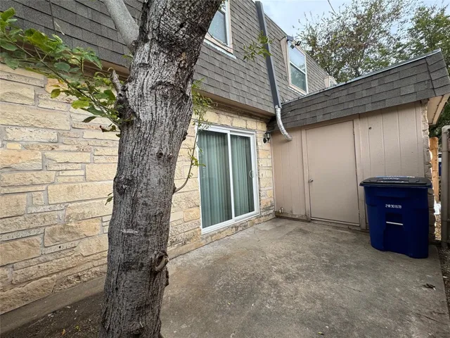 a view of a house with a yard and garage