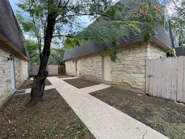 a view of a backyard with a small cabin