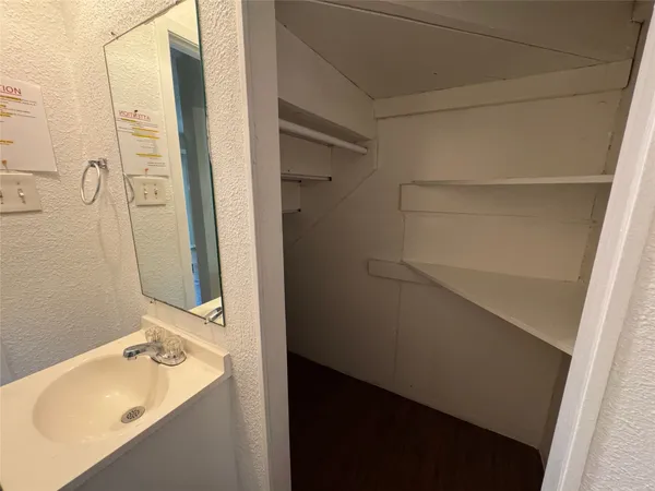 a bathroom with a sink and shower
