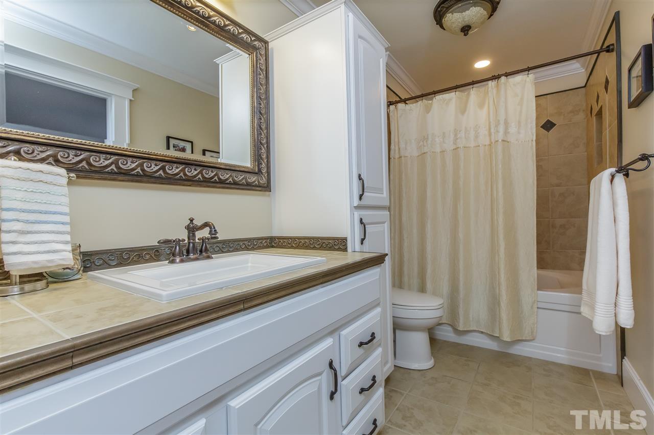 1117 Boone Road Burlington, NC 27217 - Photo 13 of 30 Tile-surround shower/tub, floor, counter and spacious storage