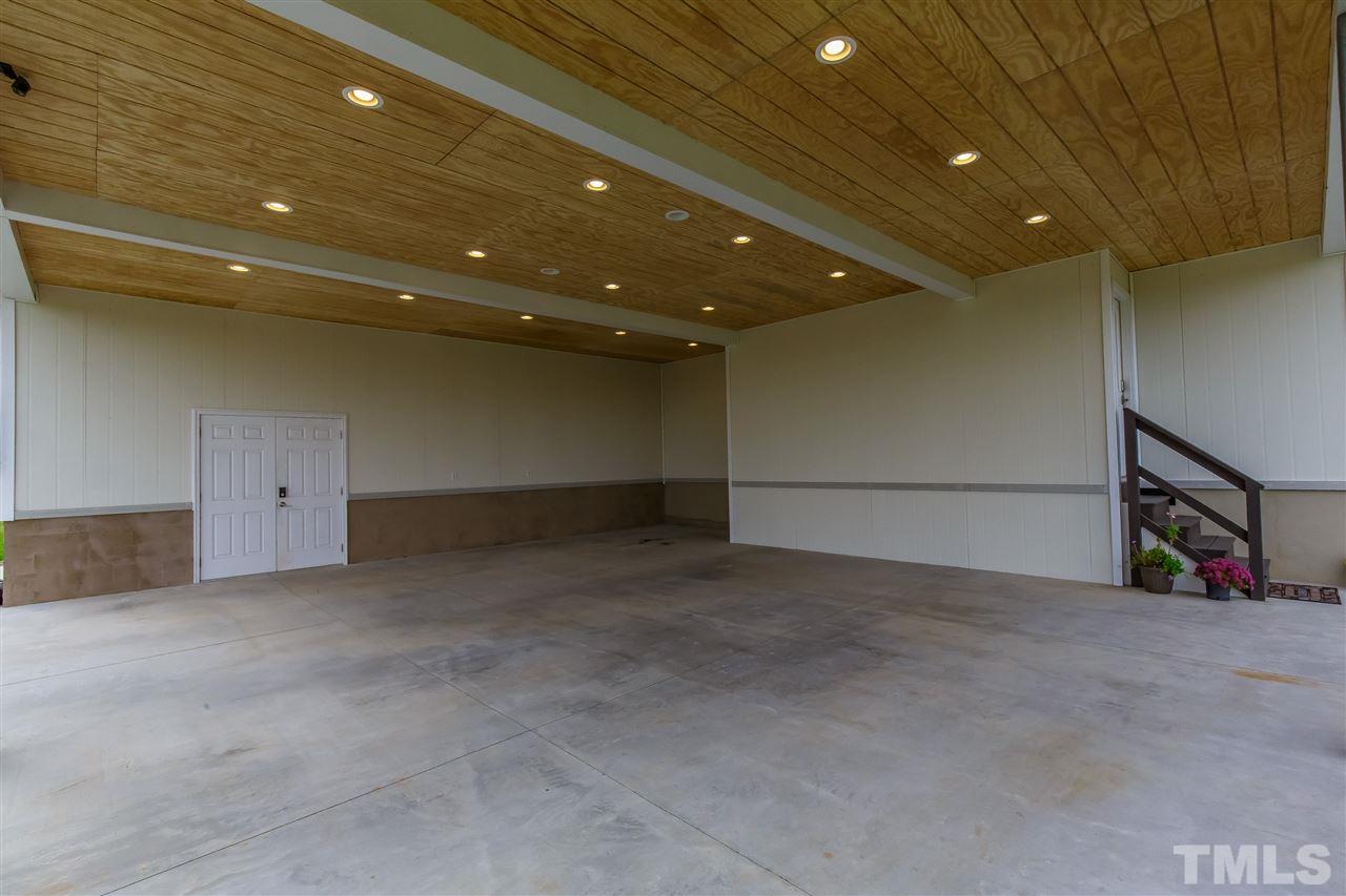 1117 Boone Road Burlington, NC 27217 - Photo 27 of 30 Measuring 32.4' x 30.1' with double door opening to single garage with incredible storage