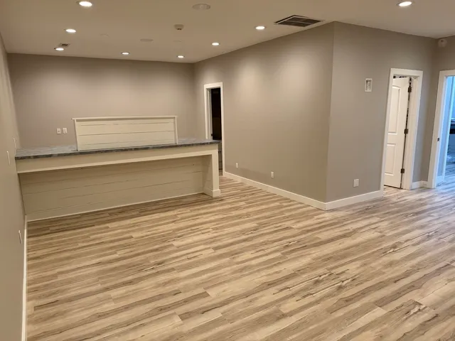 a view of room with wooden floor