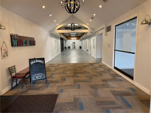 a view of a hallway with seating area