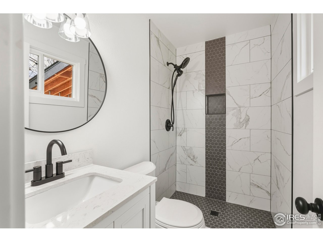 409 Franklin Street Fort Collins, CO 80521 - Photo 15 of 24 a bathroom with a sink toilet and shower