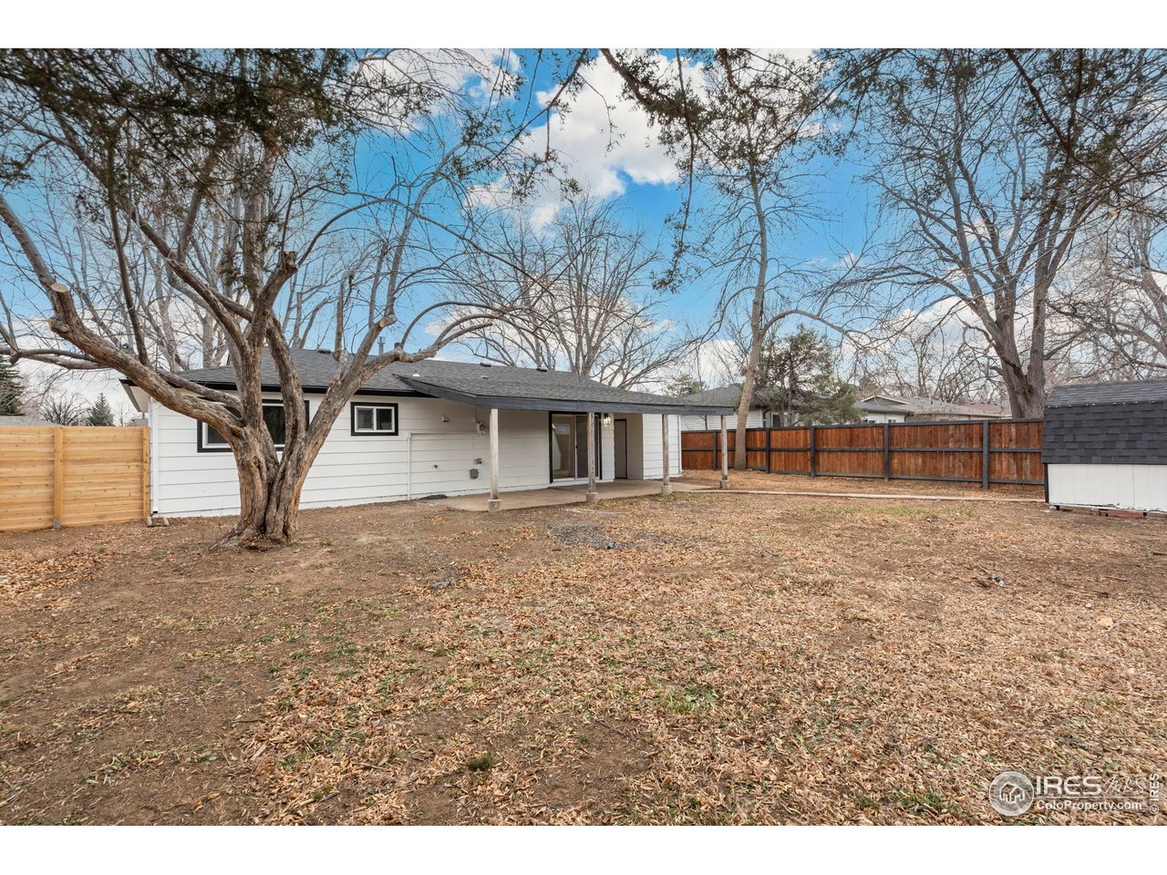 409 Franklin Street Fort Collins, CO 80521 - Photo 21 of 24 a front view of a house with a garden