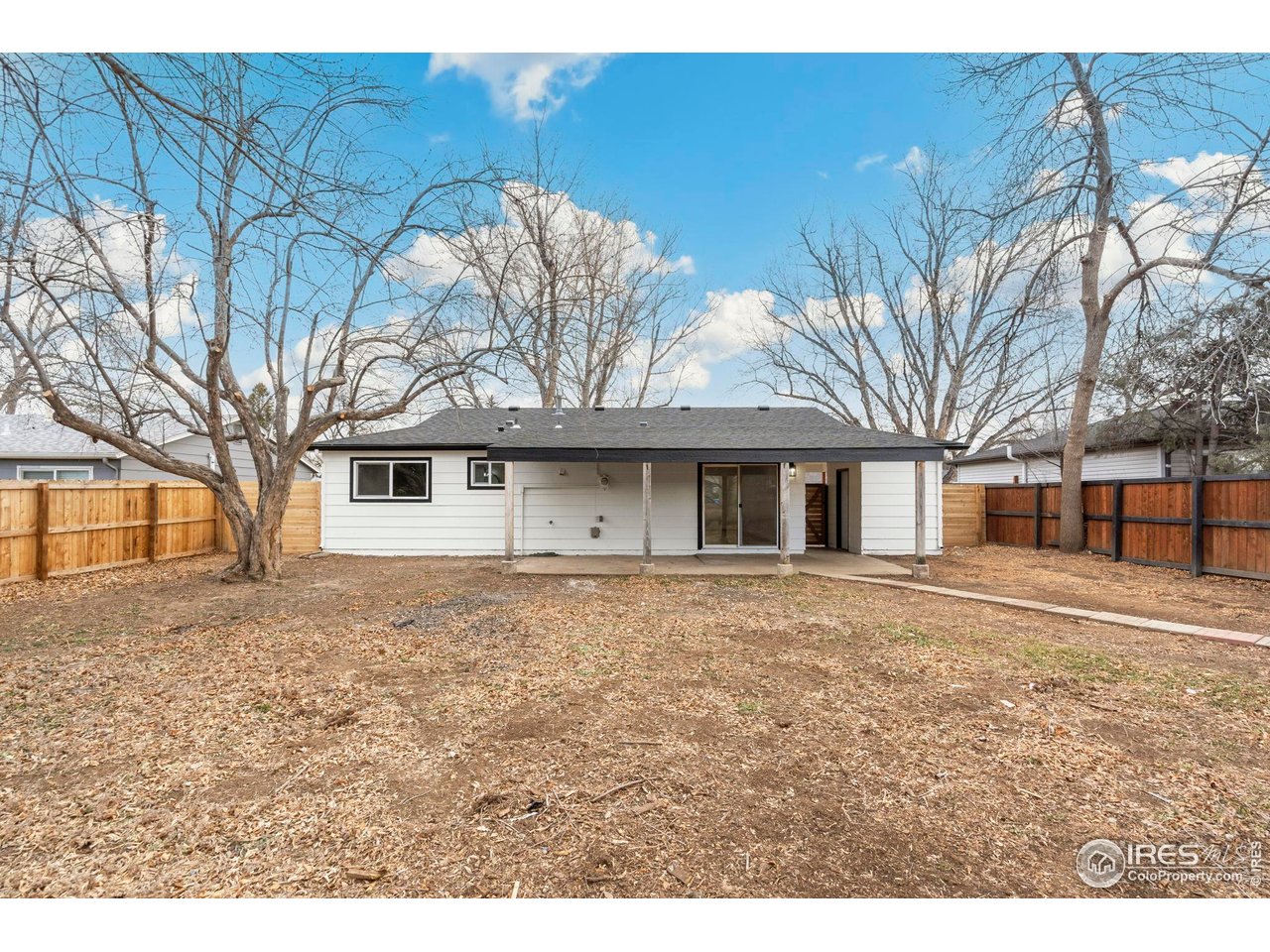 409 Franklin Street Fort Collins, CO 80521 - Photo 22 of 24 a front view of a house with a garden