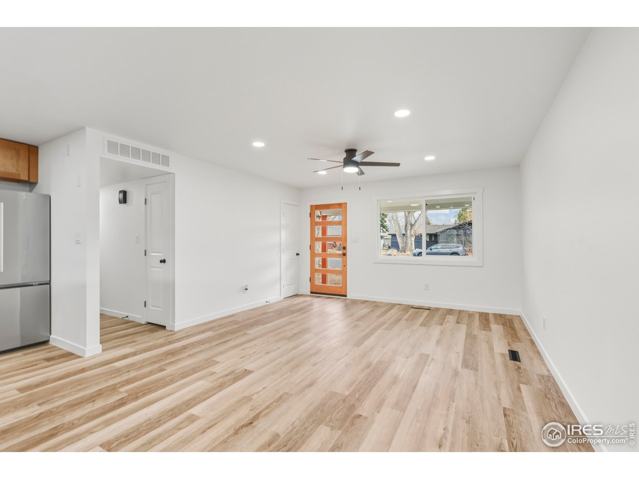 409 Franklin Street Fort Collins, CO 80521 - Photo 5 of 24 a view of an empty room and wooden floor