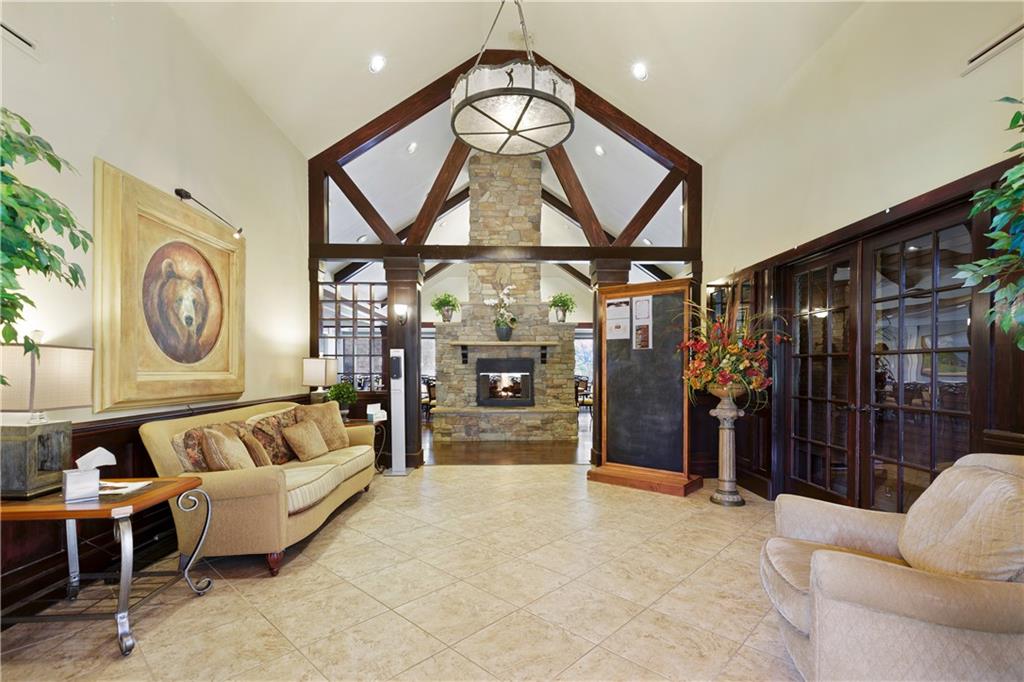 1024 Bear Paw Ridge Dahlonega, GA 30533 - Photo 23 of 41 a living room with furniture a rug and white walls