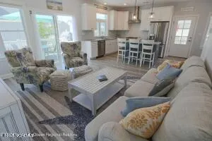 a living room with furniture rug and window