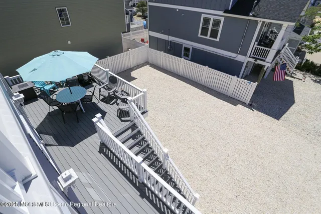 a kitchen with refrigerator cabinets and wooden floor