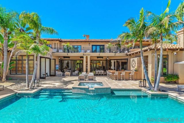 a view of a patio with swimming pool table and chairs