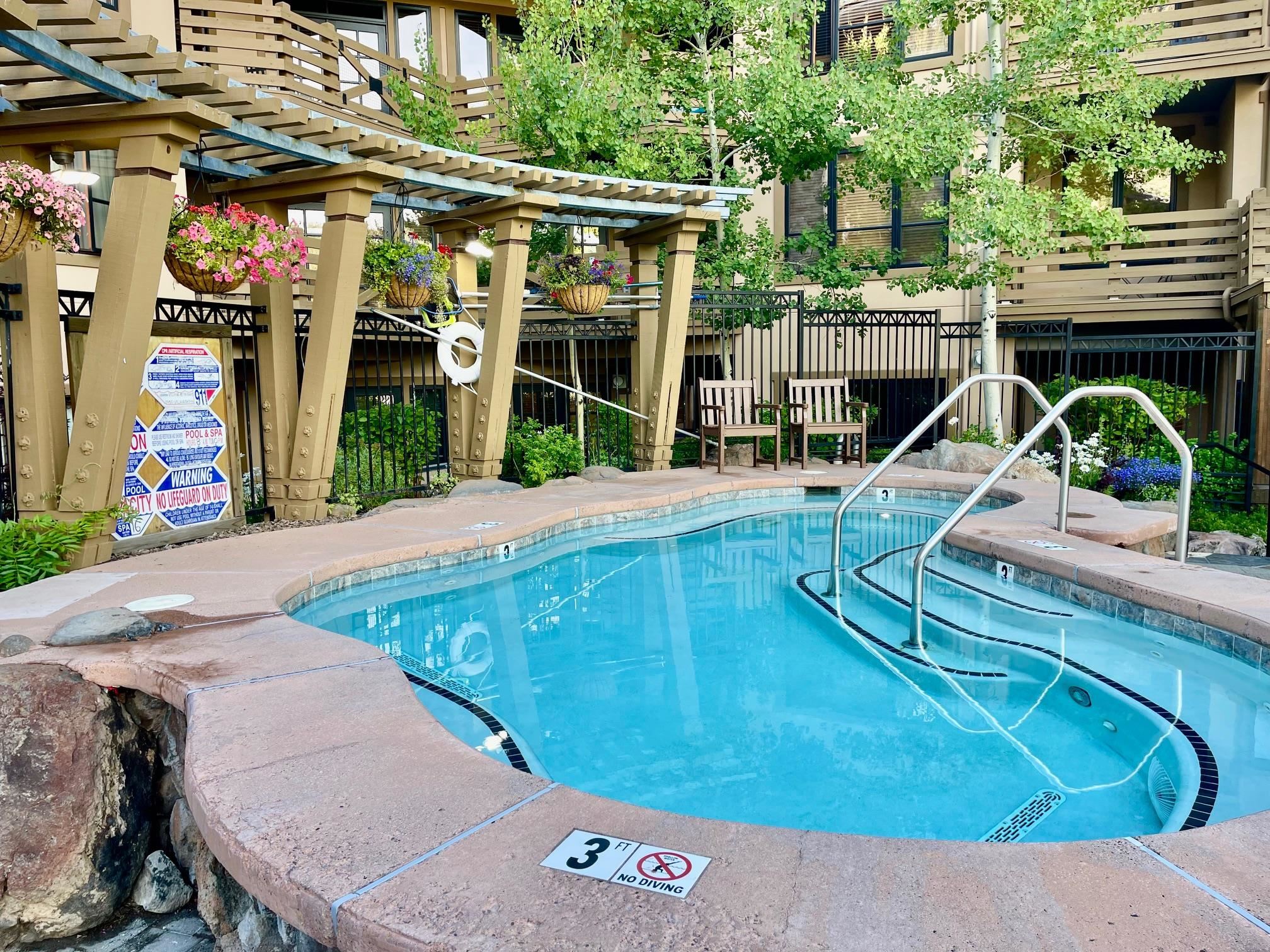 1750 Village East Road, Unit 5417 Olympic Valley, CA 96146 - Photo 16 of 18 a view of a patio with table and chairs with wooden floor and fence