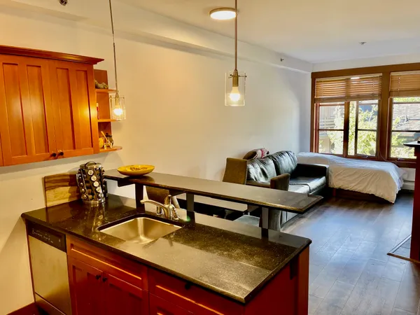 a living room with furniture and a window