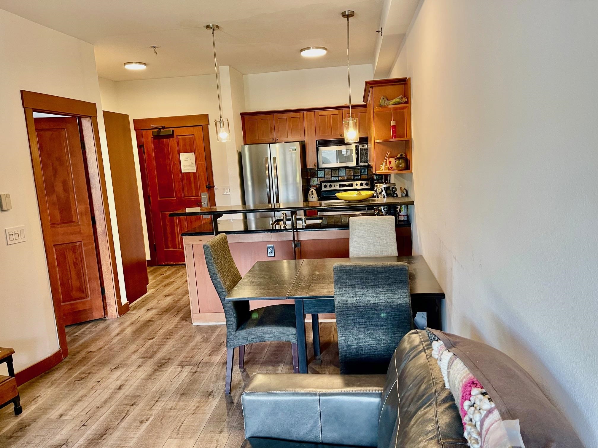 1750 Village East Road, Unit 5417 Olympic Valley, CA 96146 - Photo 7 of 18 a dining room with furniture and wooden floor