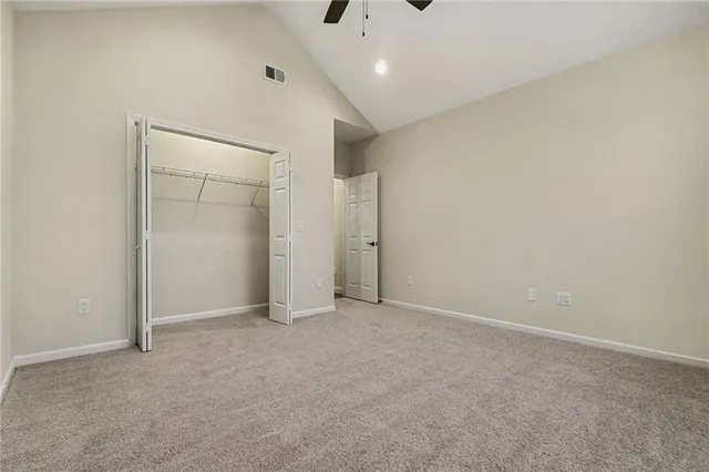 an empty room with closet area