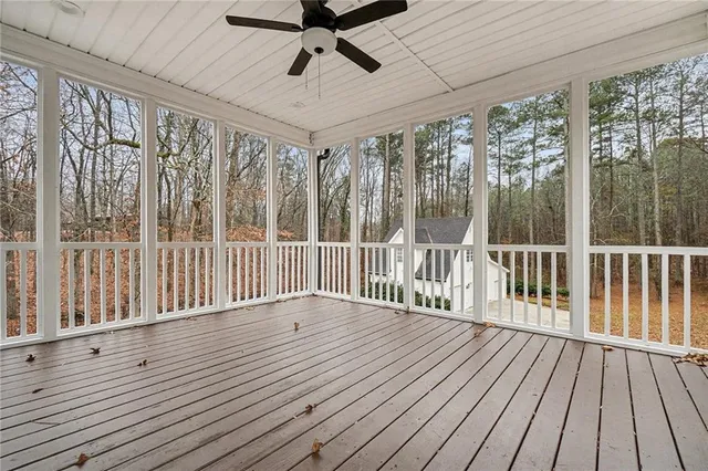 a view of a balcony with wooden floor