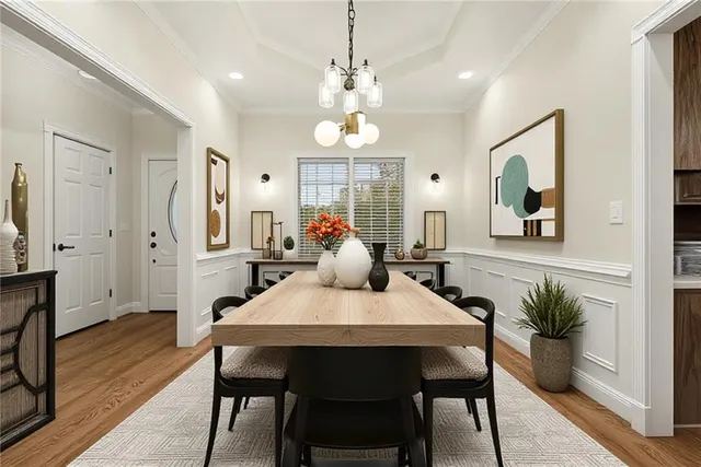 a view of a a dining room with furniture window and wooden floor