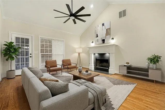 a living room with furniture and a fireplace