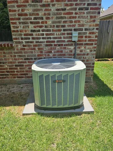 a view of a chair and table in the patio