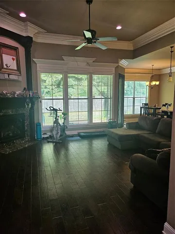 a living room with a couch and a large window