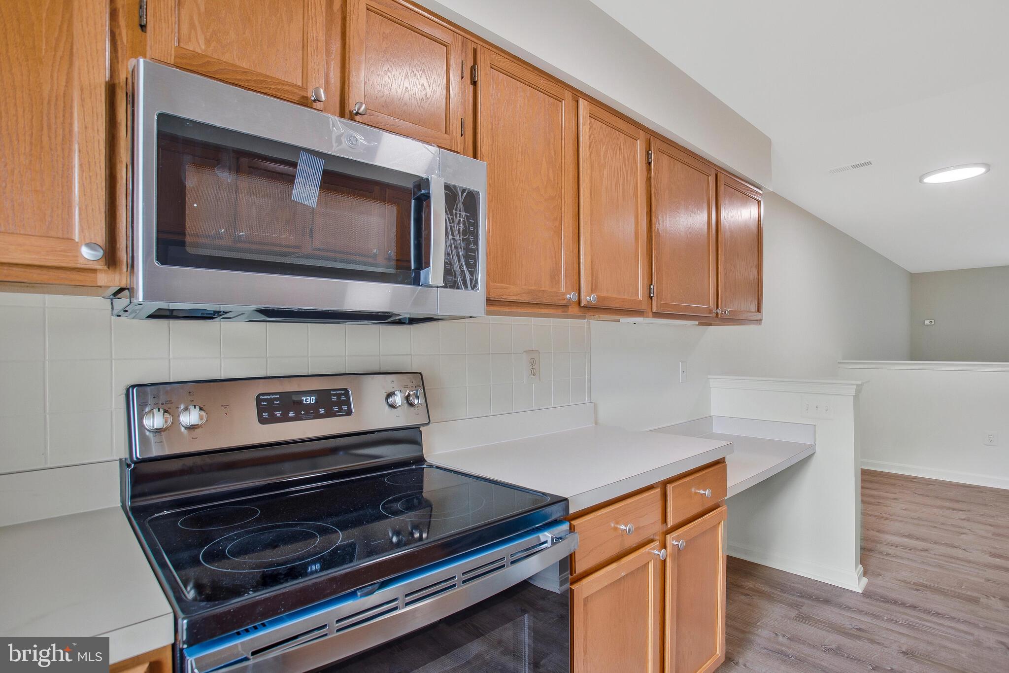 9270 Cherry Lane, Unit 66 Laurel, MD 20708 - Photo 11 of 31 Kitchen w/ Brand New SS Appliances
