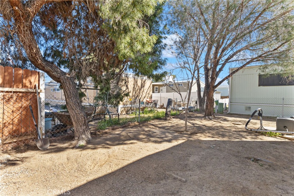 22838 Bear Valley Road, Unit 64 Apple Valley, CA 92308 - Photo 16 of 22 a view of a house with snow on the road