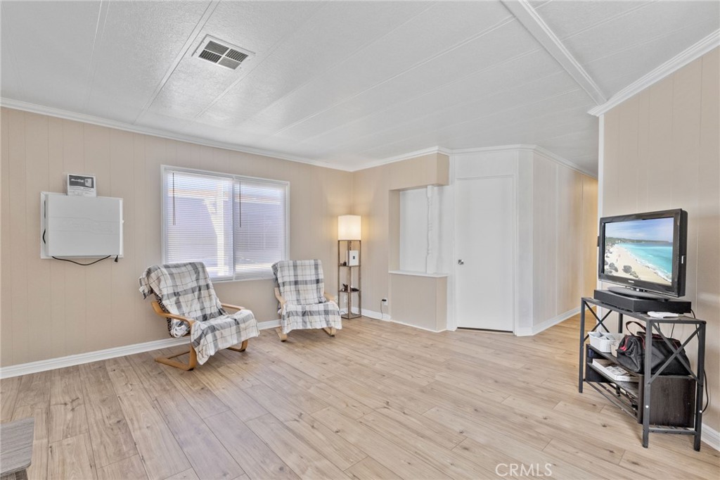 22838 Bear Valley Road, Unit 64 Apple Valley, CA 92308 - Photo 3 of 22 a view of a livingroom with furniture and a flat screen tv