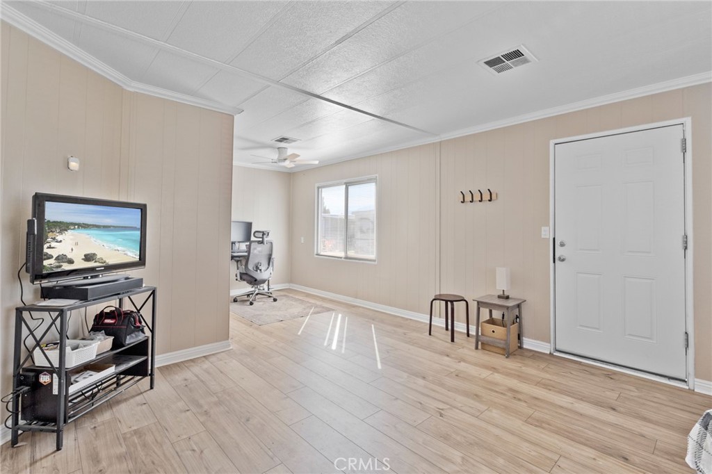 22838 Bear Valley Road, Unit 64 Apple Valley, CA 92308 - Photo 4 of 22 a view of a livingroom with furniture and workspace