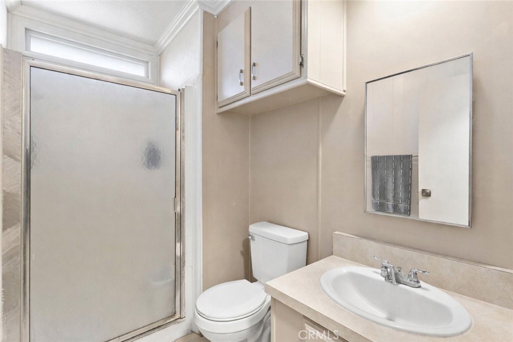 22838 Bear Valley Road, Unit 64 Apple Valley, CA 92308 - Photo 7 of 22 a bathroom with a sink toilet and shower