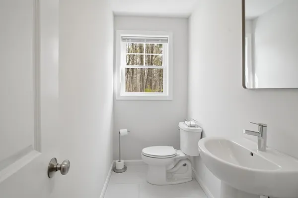 a bathroom with a sink toilet and bathtub