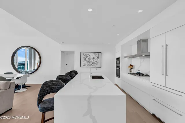 a view of living room with furniture and floor to ceiling window