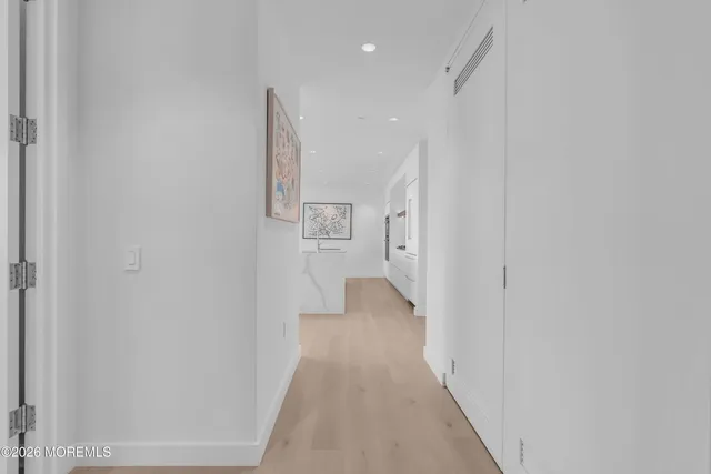 a bedroom with a bed and a television