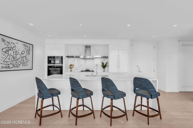 a view of kitchen with cabinets and wooden floor