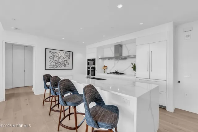 a kitchen with a sink and a large window