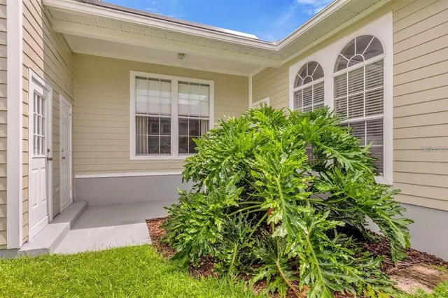a view of front door of house with yard