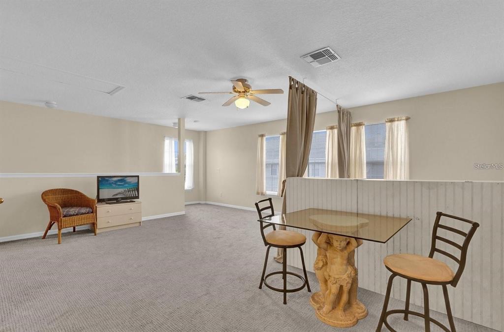 604 Nadina Place Celebration, FL 34747 - Photo 25 of 32 a living room with furniture and a window