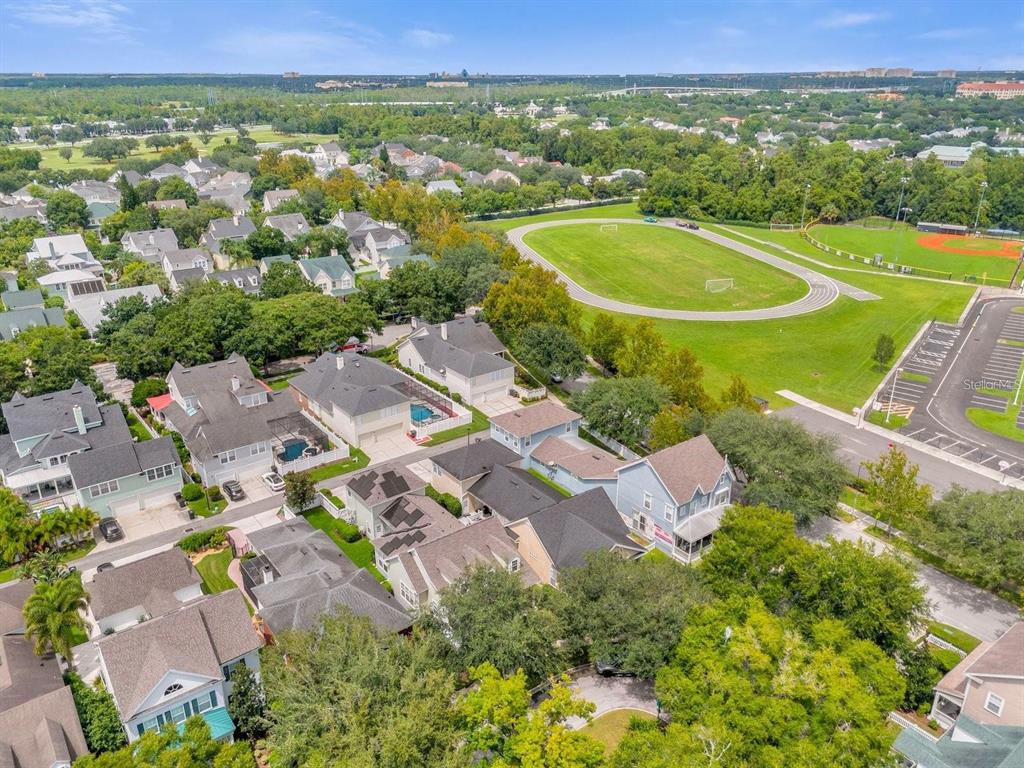 604 Nadina Place Celebration, FL 34747 - Photo 31 of 32 an aerial view of residential houses with outdoor space and street