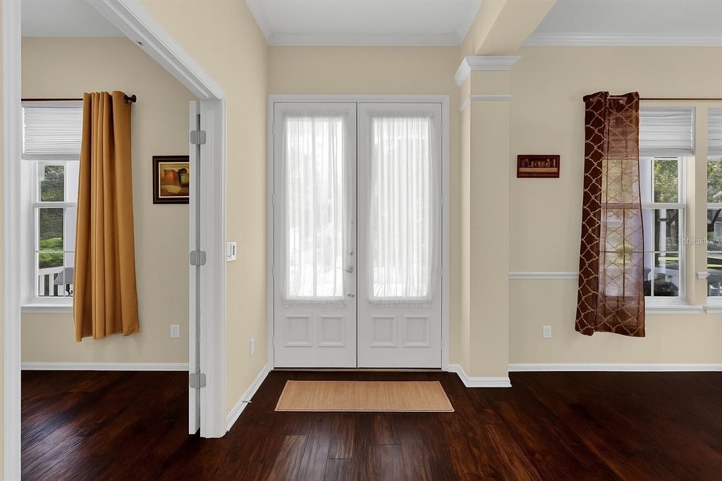 604 Nadina Place Celebration, FL 34747 - Photo 6 of 32 wooden floor in an empty room with a window