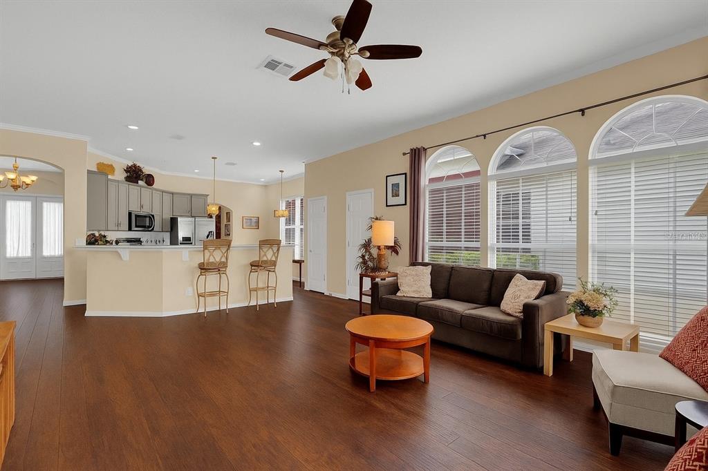 604 Nadina Place Celebration, FL 34747 - Photo 10 of 32 a living room with furniture and kitchen view