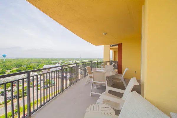 a view of a chairs and table in patio