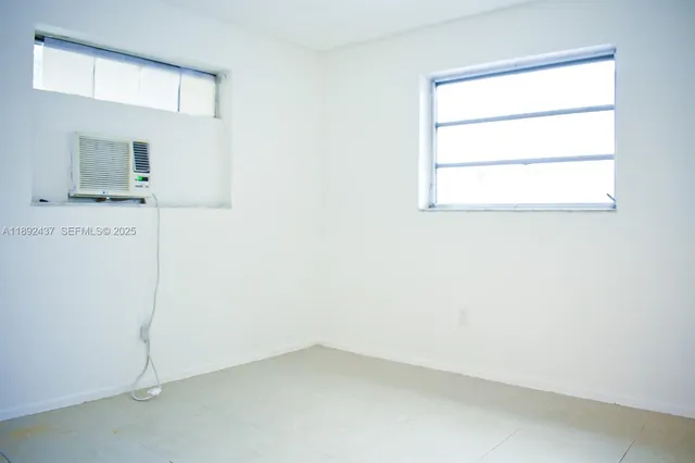 a kitchen with cabinets and white appliances